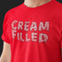 An angled shot of the 'Cream Filled' novelty t shirt, emphasizing its edgy print and Dodo Tees' rebellious spirit 