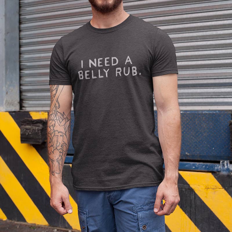 man outside wearing offensive t shirt with i need a belly rub text