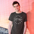 smiling man wearing patriotic shirt with with 1776 graphic.  the 1776 t shirt is tailored with side-seams for a modern fit. 