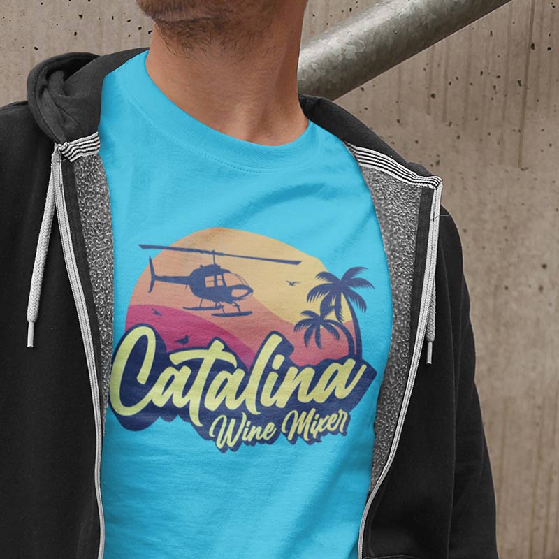 man wearing pop culture shirts with catalina wine mixer logo