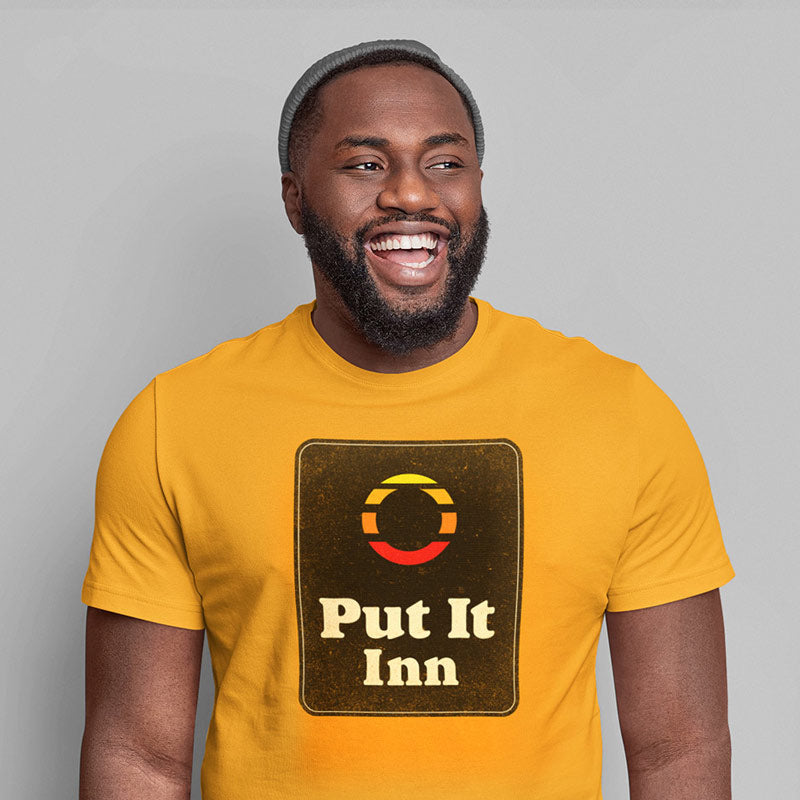 laughing man wearing inappropriate christmas present put it inn t shirt