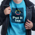 close up of man wearing offensive t shirt with put it inn logo 