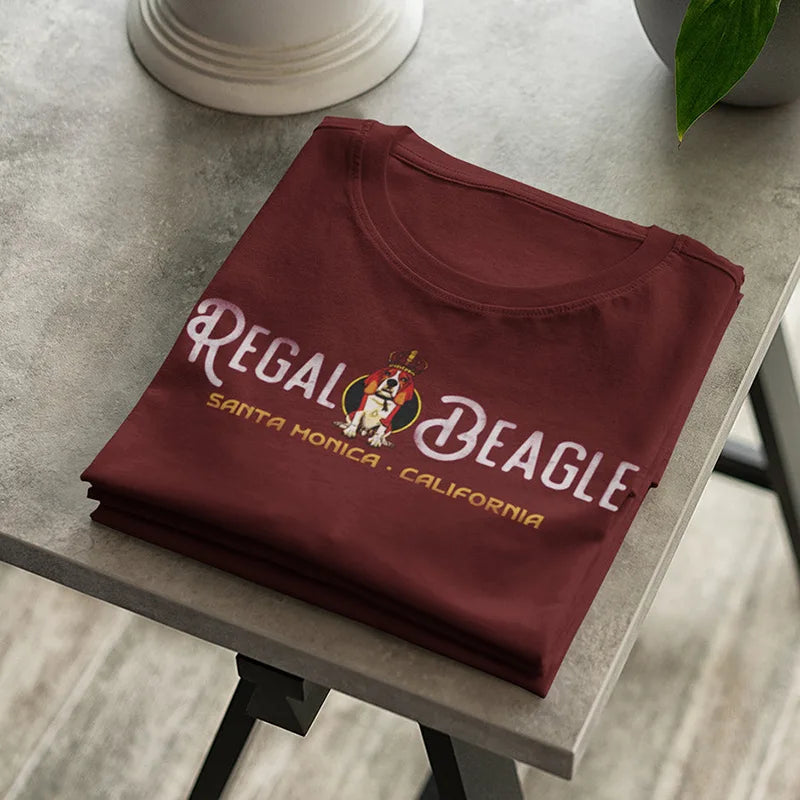 folded retro bar t shirt on table with regal beagle graphic