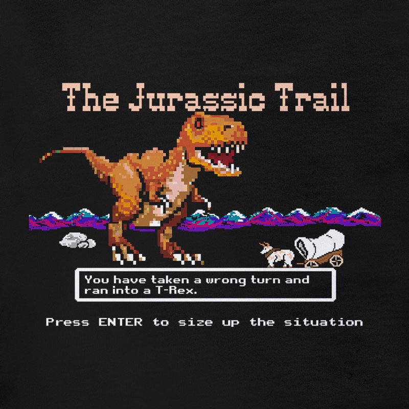 retro gamer shirts that take 8-bit graphics to a whole new era. This mens tee features a t rex dinosaur attacking Oregon Trail travelers.