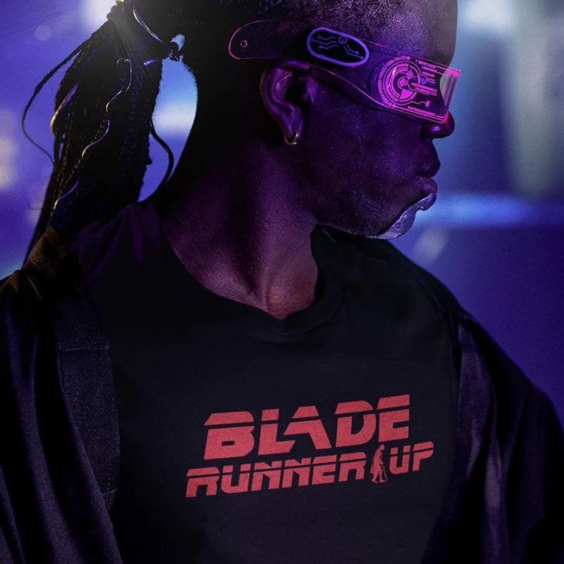 sci fi man wearing retro graphic tee with blade runner up logo