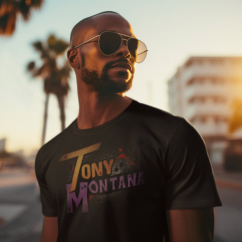 man wearing a scarface Tony Montana shirt featuring a parody logo. The movie mashups design makes ideal movie lover gifts.