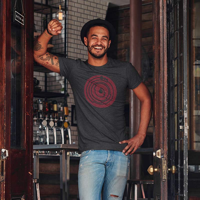 smiling man in bar doorway wearing teacher tee shirts with pi geometric graphic