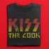 Kiss the cook bbq shirt close up. The funny food t shirts feature a distressed printing style.