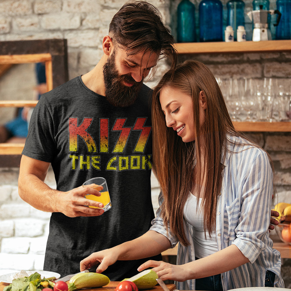 Man wearing the Dodo Tees kiss the cook funny bbq shirt. The funny food t shirts are side-seamed for a great fit.