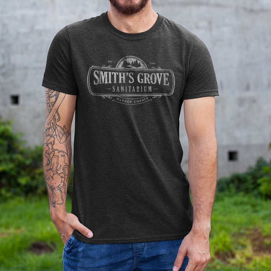 close up of man wearing smiths grove sanitarium halloween t shirts