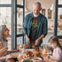 dad with family wearing kiss the cook dad joke shirt. The parody shirt makes a great Gift For BBQ Lovers.