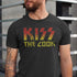 Man wearing funny bbq shirt saying kiss the cook. The funny dad shirt by Dodo Tees has a worn in look.