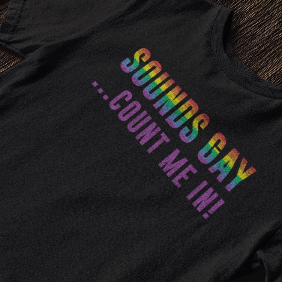 close up of pride shirt with sounds gay count me in typography. Dodo Tees Gay pride shirts feature a distressed printing style for that worn in look.